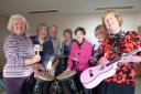 Sandra Trewin, Pat Woodhouse, Andrew Sherrey, Gaye Hadley, Sue Dennis, Janice Boswell and Penny Grimley prepare for Sunfield’s fundraising evening of music