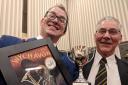 Oliver Wilson (Musical Director) and Roland Deaking (Bass player) with the trophy from the Wychavon Festival.