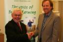 Farm handshake: New county NFU chairman Clive Davies, left with outgoing chairman Tim Jones.