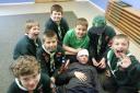 The Cub Scouts showing their bandaging skills of