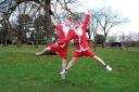 Yule jog: Kemp Santa’s limber up for this year’s fun run.