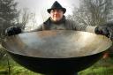 Big Pan Man: Mark Renn with one of his giant woks hired by TV celebrity chef Heston Blumenthal. Picture: Phil Loach.