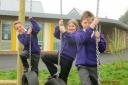 MONKEYING AROUND: From left, Cookley pupils Joey Swift, Eva Cook and Billy Davies try out the new playground.