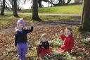 Snow joke: From left, Isabella Kennedy, 5, Oscar Niblett, 6 and Lucy Underwood, 7, on the snowdrop hunt at Abberley Hall School.