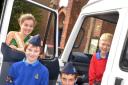Upgraded transport: Carnival queen Hannah Cornish and 1st Kidderminster Boys’ Brigade members, from left, Charlie Tindell, Oliver Reah and James Cook.