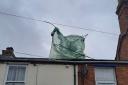 Greenhouse is blown onto roof in Kidderminster
