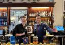 Assistant manager Louis Chance (left) and manager Paul Corner (right) behind the bar of the King and Castle
