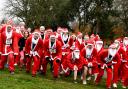 A group of Santa fun run participants get ready to run