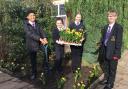 Baxter College House Parliament members planting daffodils