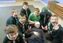 The Cub Scouts showing their bandaging skills of