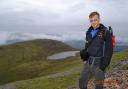 Conqueror: Jamie Brighton at the top of Mount Snowdon in Wales.