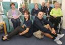 Roll up: Service users, Victoria Carpets, Community, Kemp and Nicholls Carpets and Flooring staff enjoy the new carpet. at Kemp Hospice Picture: JONATHAN HIPKISS. 421308J.