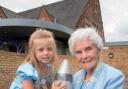 TIME DIFFERENCE: Four-year-old Phoebe Rose Harvey with 101-year-old Gwen Palmer with the time capsule that will be buried to mark the extension. 271414MH
