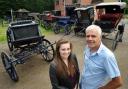 CARRIAGE AWAITS: Abby Anson, 16, and her uncle, Brian Hopkins, with the selection of carriages. Her chosen 1910 Sociable is on the left. 271437L