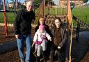 Positive energy: John Gordon of Community Action Newtown, with member Vanessa Hughes, holding niece Courtney White, 1, and Courtney's mother Melissa Perkins, in the Manor Road  play area.