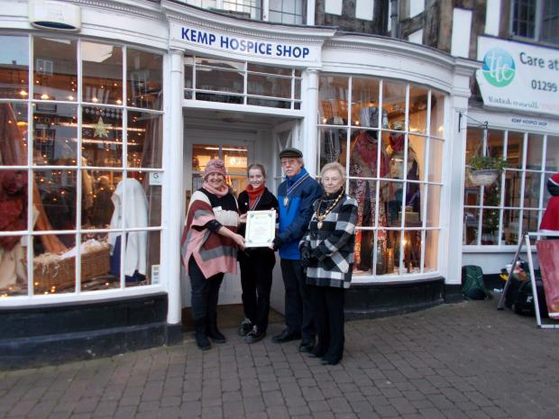 Kidderminster Shuttle: The Mayor, Mayoress and Young Mayor of Bewdley, Cllr Paul Harrison, Mrs Mary Breese and Storm Powell presenting the ‘Best Dressed Window’ Winner’s Certificate to Hayley Whitefoot from KEMP Hospice.