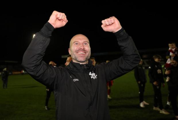 Kidderminster Shuttle: Kidderminster Harriers' manager Russ Penn celebrates after the Emirates FA Cup third round match at the Aggborough Stadium. Photo: PA