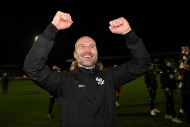 Kidderminster Harriers' manager Russ Penn celebrates after the Emirates FA Cup third round match at the Aggborough Stadium. Photo: PA
