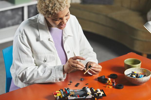 Kidderminster Shuttle: A woman putting together the LEGO Delorean. Credit: LEGO
