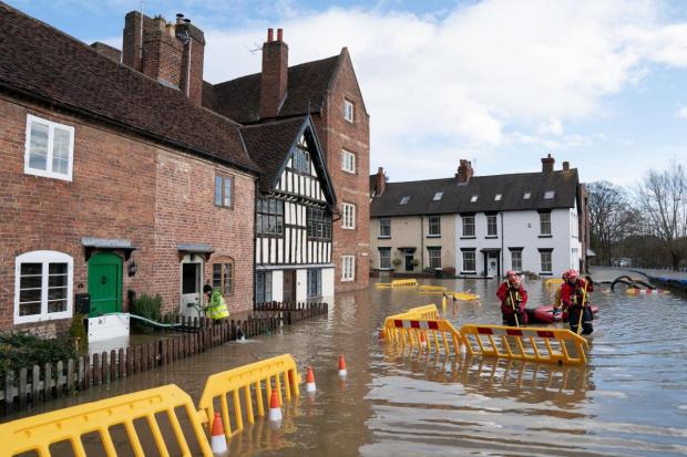 Search and rescue teams check on residents in Bewdley. Photo: PA