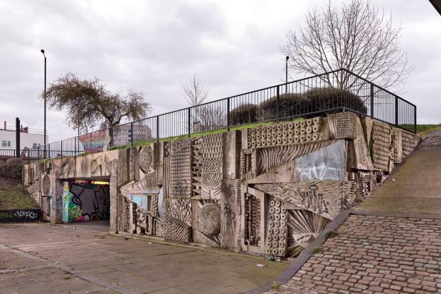 The murals in the pedestrian concourse of Hockley flyover in Birmingham, by sculptor William Mitchell, have been given listed status. (Historic England/ PA)