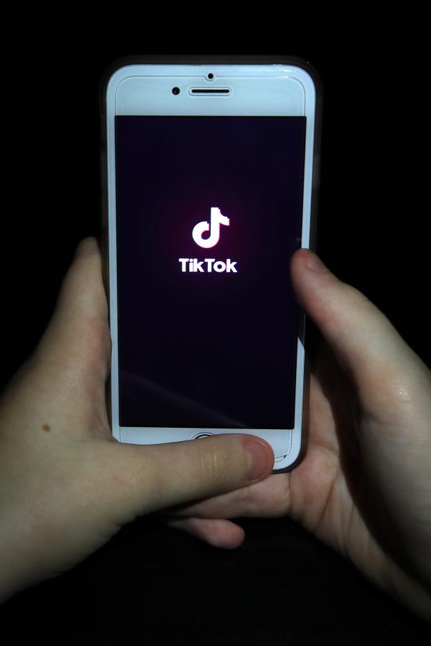 Kidderminster Shuttle: A person with TikTok open on their phone. Credit: PA