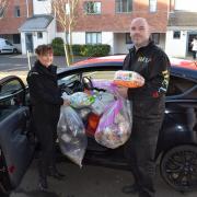 HELP volunteers Jo Ridsdill-Wardle and Dave Griffin with a week's worth of donations