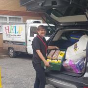 HELP's Jo Ridsdill-Wardle loads food donations for the homeless