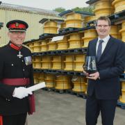 Vice Lord Lieutenant Roger Brunt presents the award to Chris Akers, Managing Director of Titan Steel Wheels