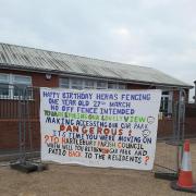 Banner attached to fencing loathed by Hartlebury residents