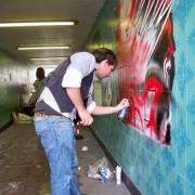 Transformation: Artist Andy May works on a piece at Subway Deluxe.