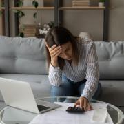 Woman stressed over financial problems (stock)