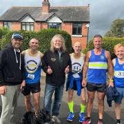 Robert Plant (third from left) congratulated runners taking part in the historic 'Round The Wall' race in Cookley