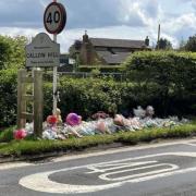 Flowers left on the road following the fatal crash