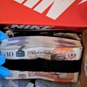 SEIZED: Some of the cash seized by officers as part of the drugs investigation