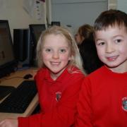 Logging on: Sytchampton Endowed First School pupils Rhianna Dunn and William Johnston-Hubbold, both aged seven.