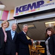 CUTTING THE TAPE: From left, shop manager Dawn McAdam, Terry and Maurice Cohen and Lynne Jones open the new shop. Picture: Louise Adey. 111416LA.
