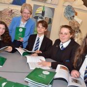 WHITE ROSE: Author Fenella (Heather) Flack with Bewdley pupils Meg Lock, Tom Blyth, Saskia Judd and Jodie Grey. Picture: Colin Hill