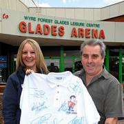 Darts souvenir: Clare Kingscott, Glades marketing and events manager, with Matt Sheehan, promoter of Legends of Darts night, with the shirt signed by the country's top players which will be raffled for the appeal.