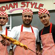 Community spirit: From left, brothers Imad, Syed and Fahad Ahmed, of Indian Style takeaway.