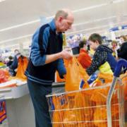 Brilliant result: Michael Surridge and son, Alex, 10, during the bag-packing session at Sainsbury's.