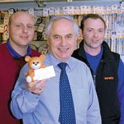 Cash on the cards: From left, Paul Howells, service engineer, owner John Davies and Gavin Lawrence, manager of Hire-It, where staff made donations instead of sending Christmas cards.