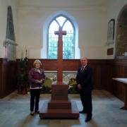 Lest We Forget author Mary Arden-Davis and cast member Philip Greenway with the half sized detailed replica of the war memorial, which will be constructed in the church during the first half of the play.